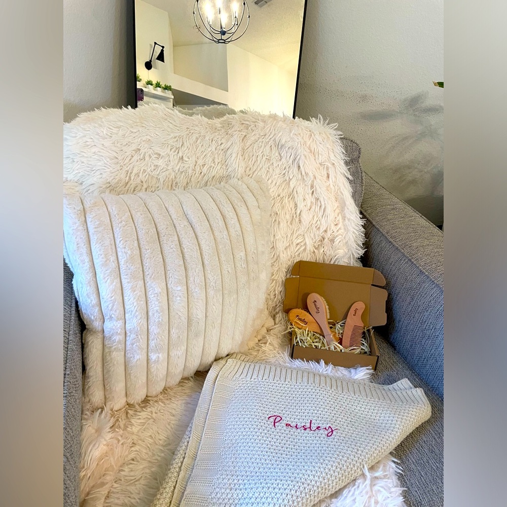 Embroidered baby blanket and baby brush set both with the name Paisley on it